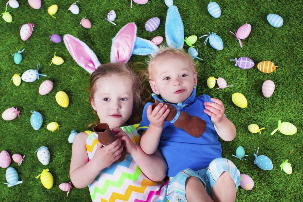 Thumper Massager Kids eating chocolate rabbit on Easter egg hunt